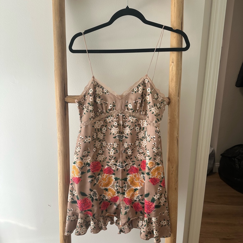 REVOLVE NBD Floral Ruffe Bottom Romper